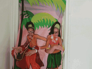 Patty and Bert behind hula facades.