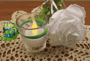 candle and white rose